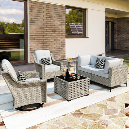 Ensemble de 6 chaises pivotantes d'extérieur en osier OVIOS avec table basse à énergie solaire