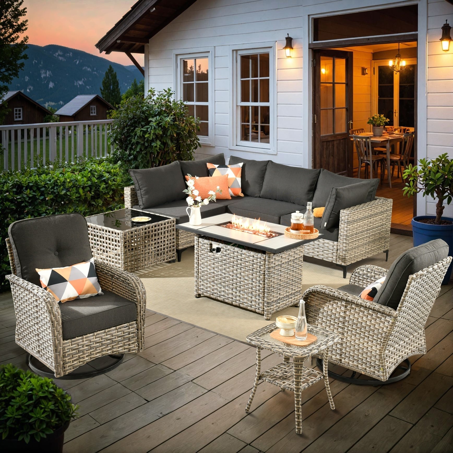 Ensemble de 9 chaises pivotantes d'extérieur en osier OVIOS avec table à feu