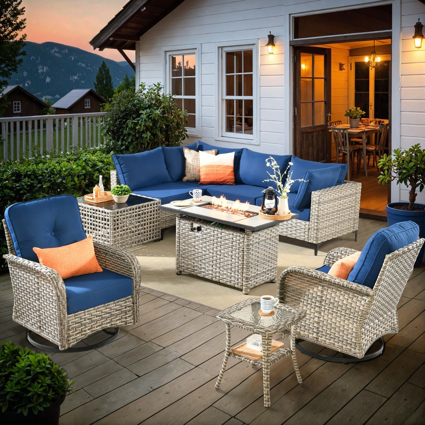 Ensemble de 9 chaises pivotantes d'extérieur en osier OVIOS avec table à feu