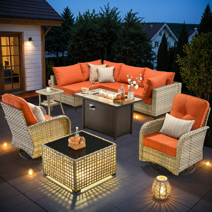Ensemble de 9 chaises pivotantes d'extérieur en osier OVIOS avec table à feu