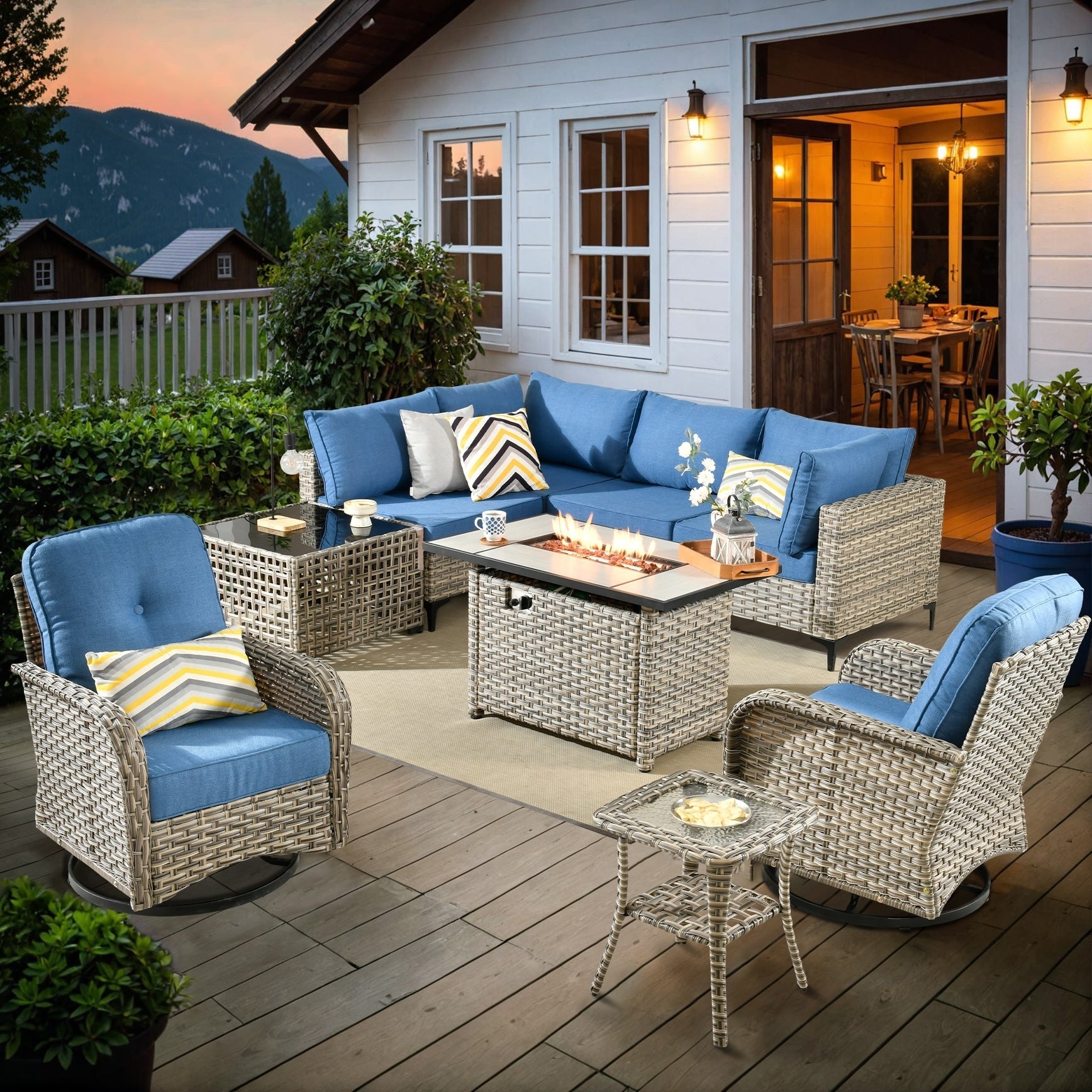 Ensemble de 9 chaises pivotantes d'extérieur en osier OVIOS avec table à feu