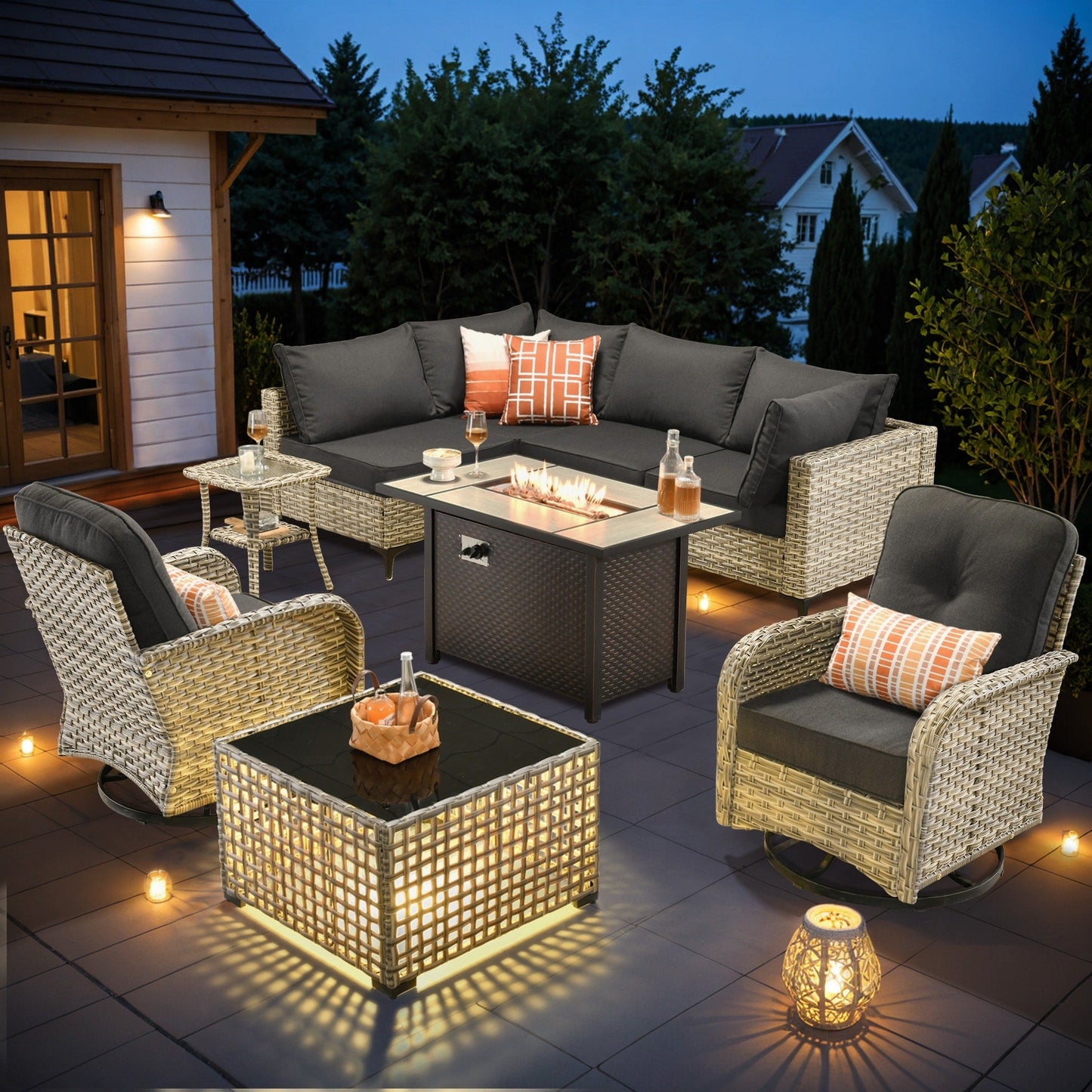Ensemble de 9 chaises pivotantes d'extérieur en osier OVIOS avec table à feu