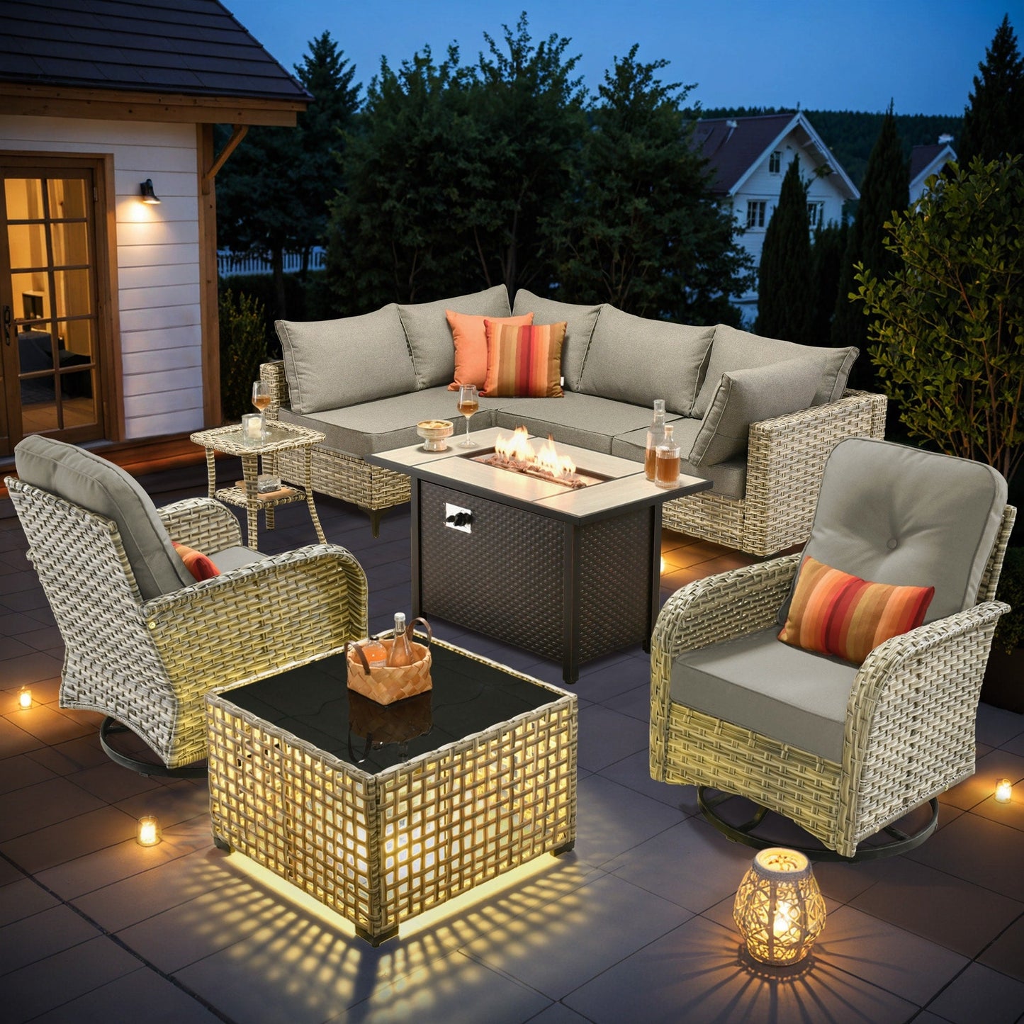 Ensemble de 9 chaises pivotantes d'extérieur en osier OVIOS avec table à feu