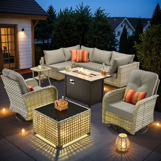 Ensemble de 9 chaises pivotantes d'extérieur en osier OVIOS avec table à feu