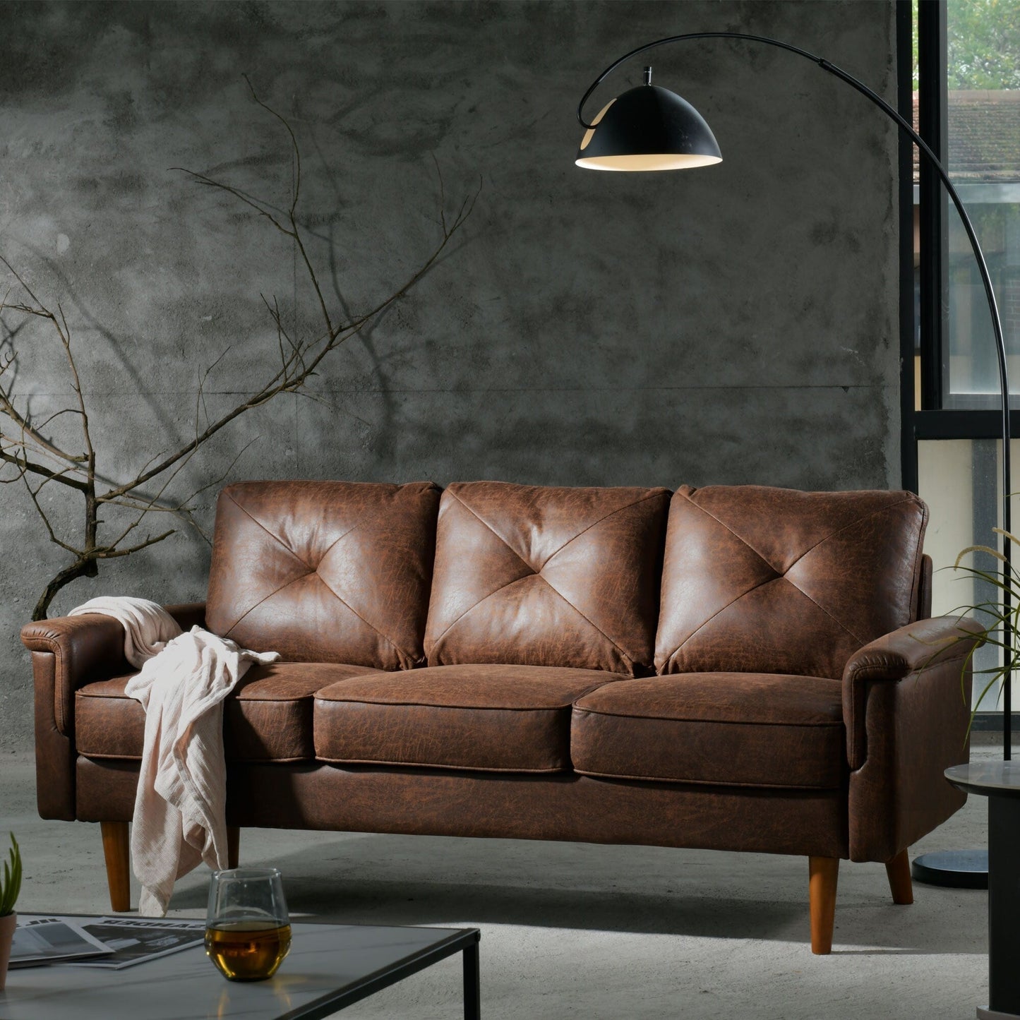 Canapé d'intérieur OVIOS Rive Design avec coussin et pieds en bois