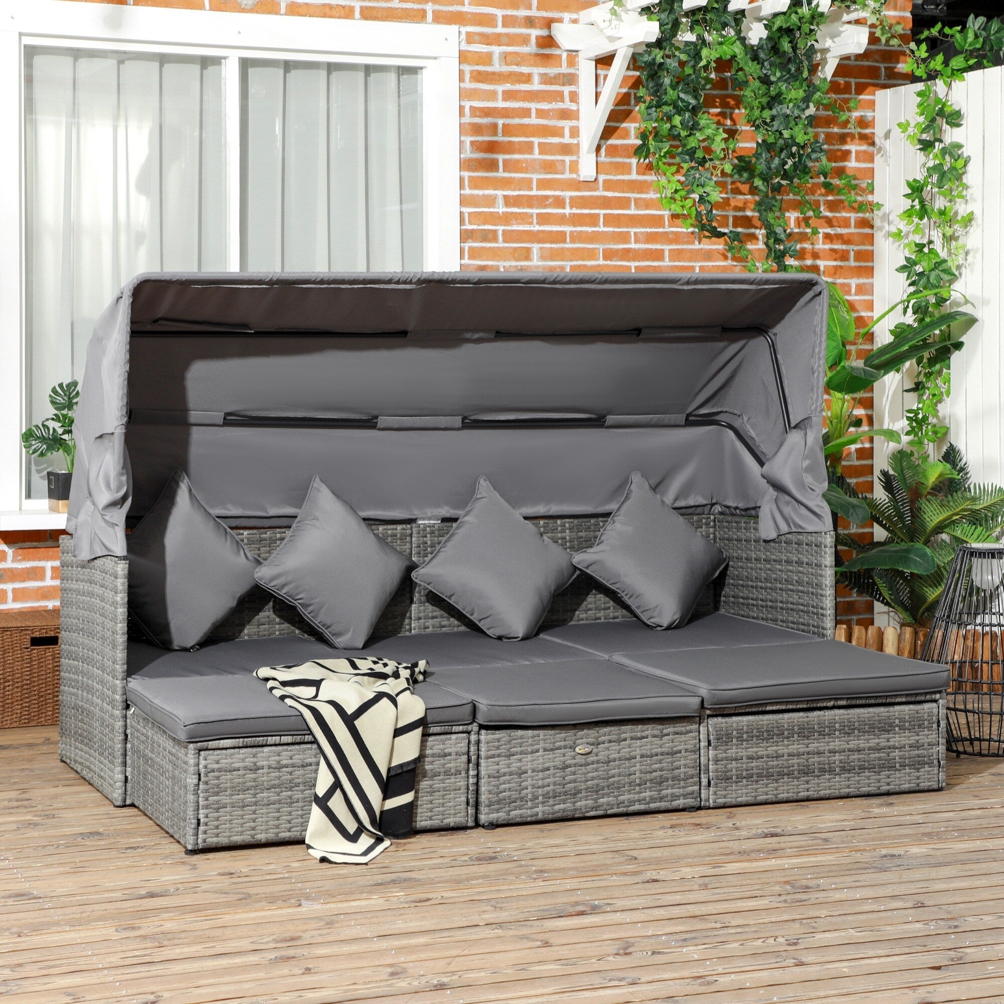 Ensemble de meubles de jardin Outsunny 4 pièces avec coussins, méridienne en rotin synthétique avec auvent rétractable et canapé d'extérieur sectionnel