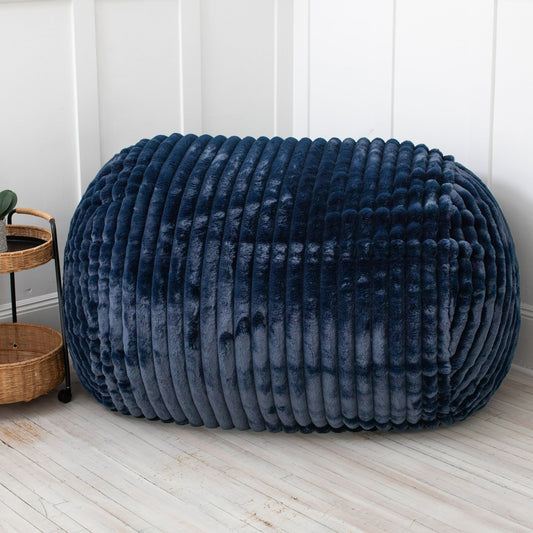 Pouf causeuse en fausse fourrure côtelée - 64 - Bleu nuit