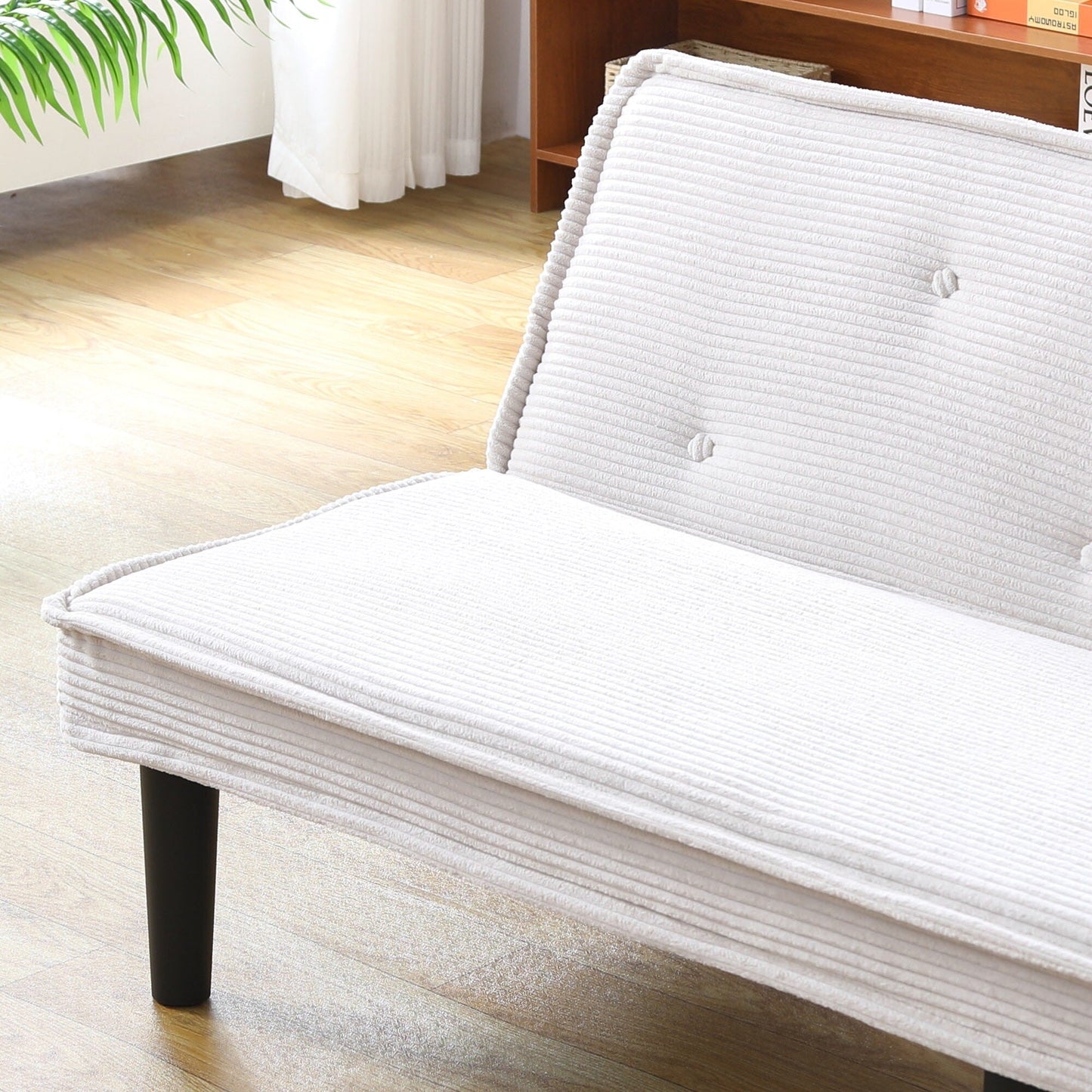 Ce canapé-lit en velours côtelé de 66 pouces peut basculer entre les deux formes confortables